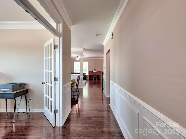 5797 Mcclintock Dr, Denver, NC 28037 - hallway featuring ornamental molding, a decorative wall, dark wood-type flooring, a wainscoted wall, and french doors
