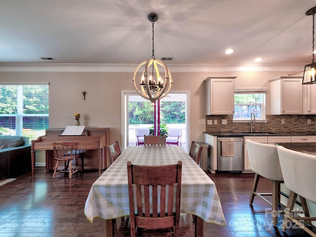 5797 Mcclintock Dr, Denver, NC 28037 - dining area with a chandelier, dark wood finished floors, and ornamental molding