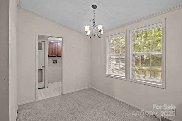 200 Southwood Park Rd, Mooresville, NC 28117 - carpeted spare room featuring a chandelier and ornamental molding