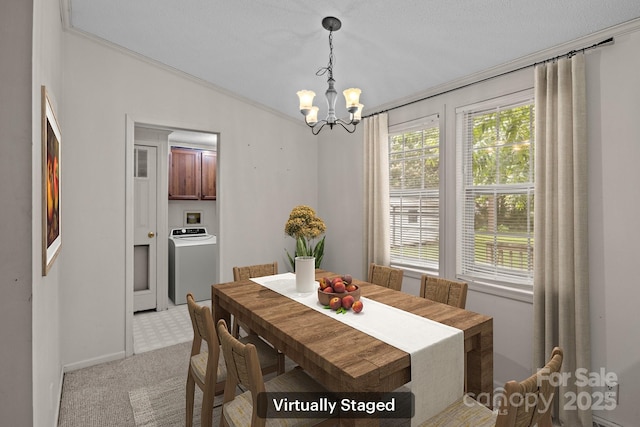 200 Southwood Park Rd, Mooresville, NC 28117 - dining space with washer / dryer, a chandelier, light carpet, and ornamental molding