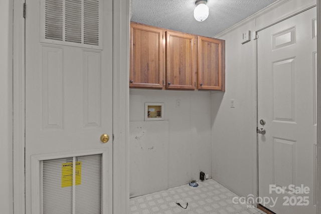 200 Southwood Park Rd, Mooresville, NC 28117 - washroom featuring cabinet space, hookup for a washing machine, light floors, and a textured ceiling