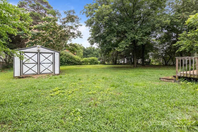 200 Southwood Park Rd, Mooresville, NC 28117 - view of green lawn featuring a storage unit and view of wooded area