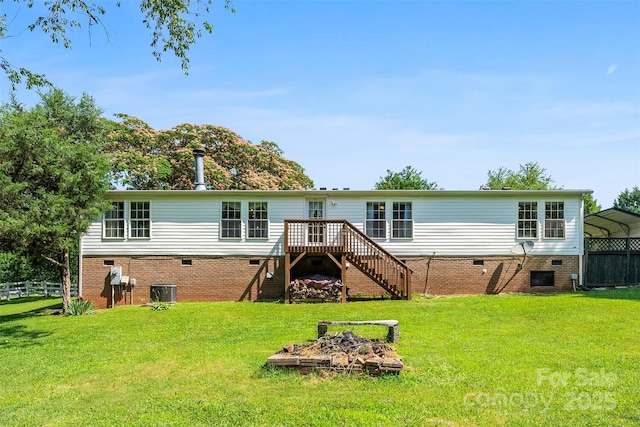 5425 Creek Run Ct, Kings Mountain, NC 28086 - rear view of house featuring stairs, crawl space, a wooden deck, a carport, and an outdoor fire pit