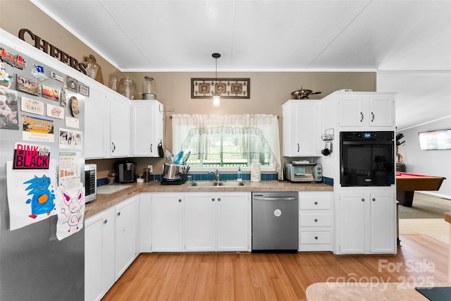 5425 Creek Run Ct, Kings Mountain, NC 28086 - kitchen featuring stainless steel appliances, light wood-type flooring, white cabinetry, light countertops, and decorative light fixtures