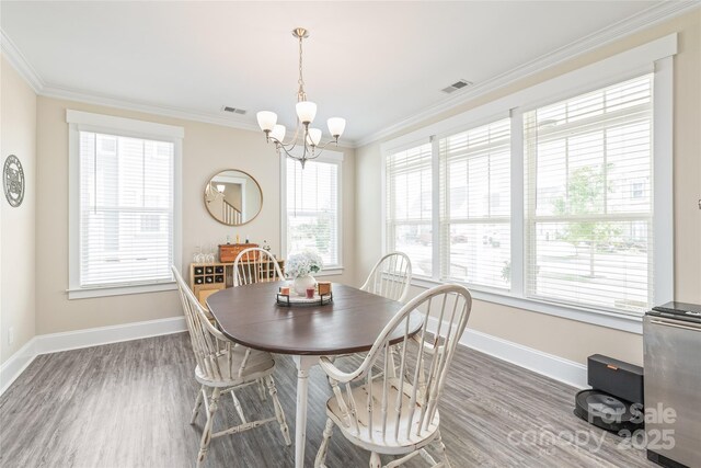 257 Auburn View Rd, Rock Hill, SC 29730 - dining space with wood finished floors, a chandelier, and ornamental molding