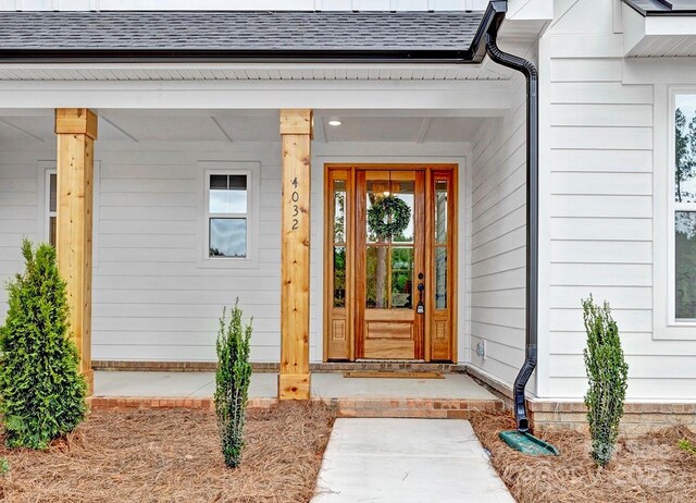 4032 Brandy Creek Ct, Clover, SC 29710 - entrance to property featuring a shingled roof and a porch