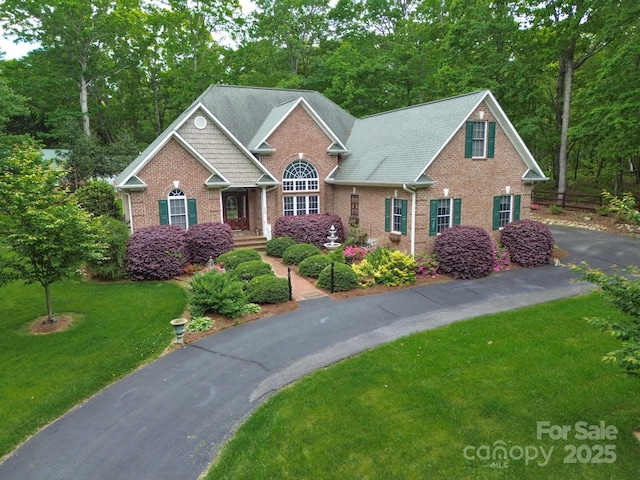 2400 Saint John Rd, East Bend, NC 27018 - view of front of home featuring brick siding and a front lawn