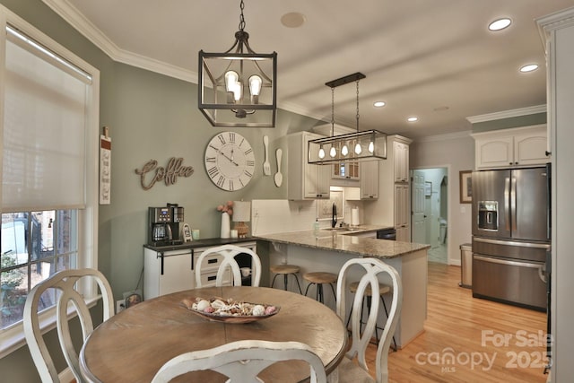 2400 Saint John Rd, East Bend, NC 27018 - dining room with crown molding, light wood finished floors, recessed lighting, and a chandelier
