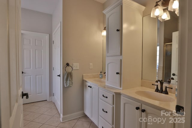2400 Saint John Rd, East Bend, NC 27018 - bathroom with double vanity, tile patterned flooring, and an enclosed shower