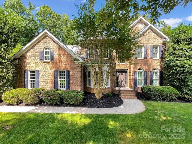 2027 Brook View Ct, Matthews, NC 28104 - view of front facade with brick siding and a front lawn
