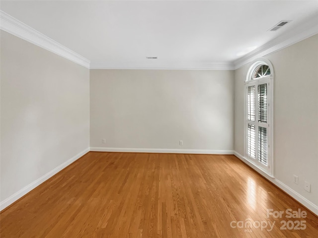 2027 Brook View Ct, Matthews, NC 28104 - spare room featuring light wood finished floors, crown molding, and healthy amount of natural light