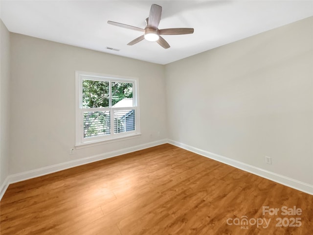 2027 Brook View Ct, Matthews, NC 28104 - unfurnished room with light wood-type flooring and a ceiling fan