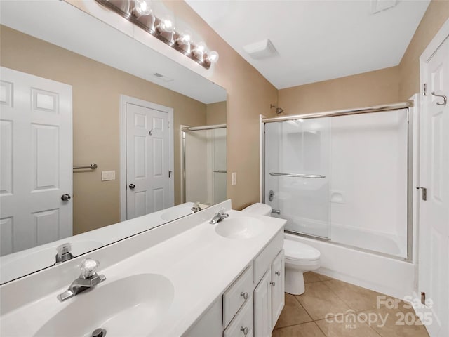 2027 Brook View Ct, Matthews, NC 28104 - bathroom featuring double vanity, tile patterned flooring, and combined bath / shower with glass door