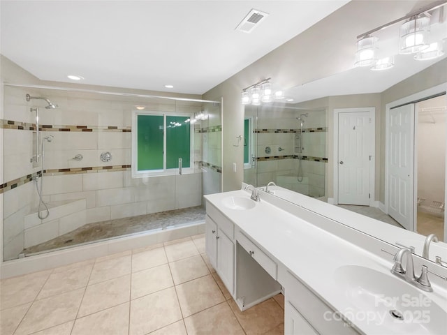 2027 Brook View Ct, Matthews, NC 28104 - bathroom featuring a stall shower, double vanity, a closet, tile patterned flooring, and recessed lighting