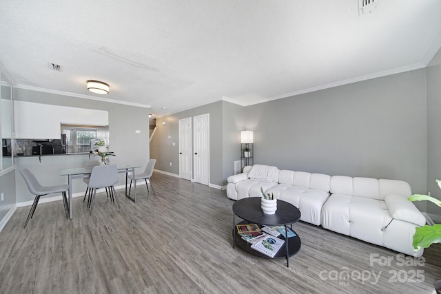 502 Heritage Pkwy, Fort Mill, SC 29715 - living room featuring wood finished floors and ornamental molding
