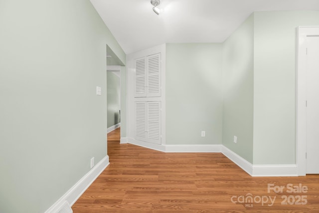 318 W Peeler St, Salisbury, NC 28146 - corridor featuring light wood-style flooring and baseboards