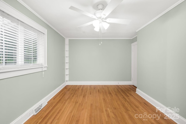 318 W Peeler St, Salisbury, NC 28146 - unfurnished room featuring ceiling fan, light wood-style flooring, and crown molding