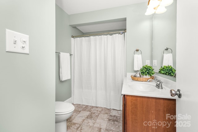 318 W Peeler St, Salisbury, NC 28146 - bathroom featuring vanity, curtained shower, and stone finish floors