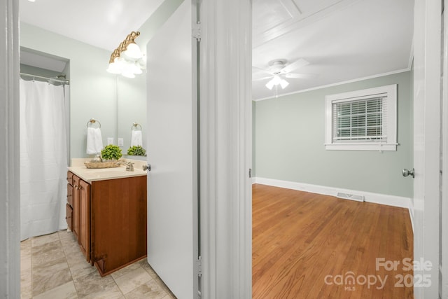 318 W Peeler St, Salisbury, NC 28146 - full bathroom featuring vanity, ceiling fan, and crown molding