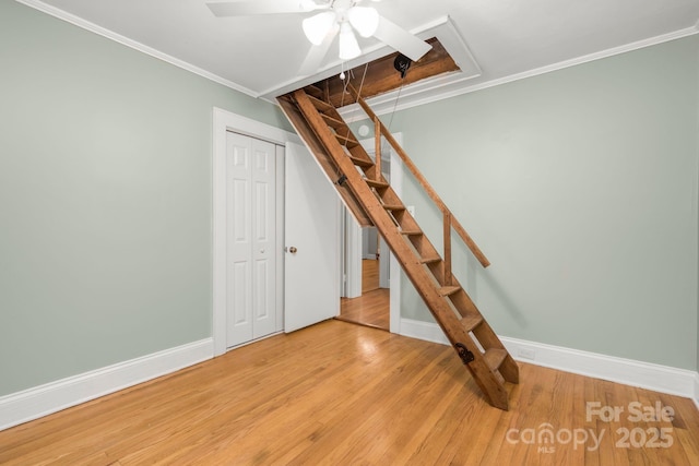 318 W Peeler St, Salisbury, NC 28146 - below grade area featuring wood finished floors, crown molding, ceiling fan, and stairway