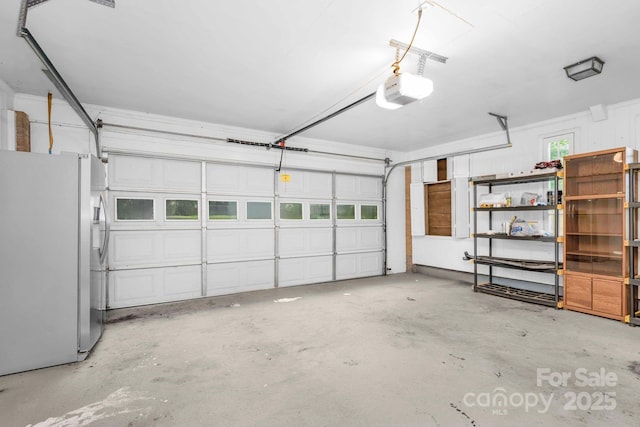 318 W Peeler St, Salisbury, NC 28146 - garage featuring freestanding refrigerator and a garage door opener