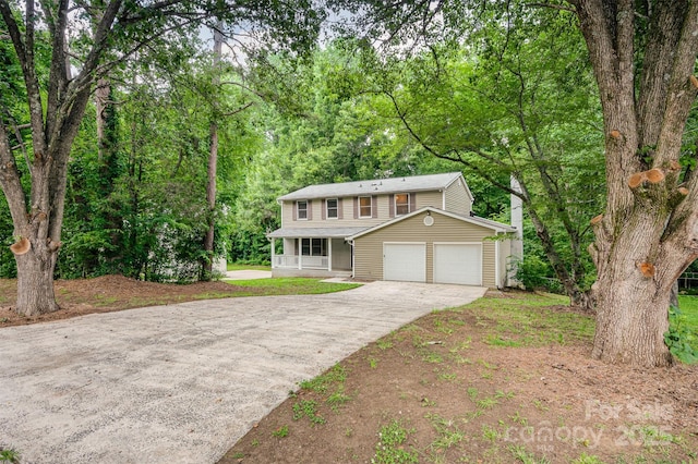 7008 Wannamaker Ln, Charlotte, NC 28226 - view of front of house featuring concrete driveway, a porch, and an attached garage