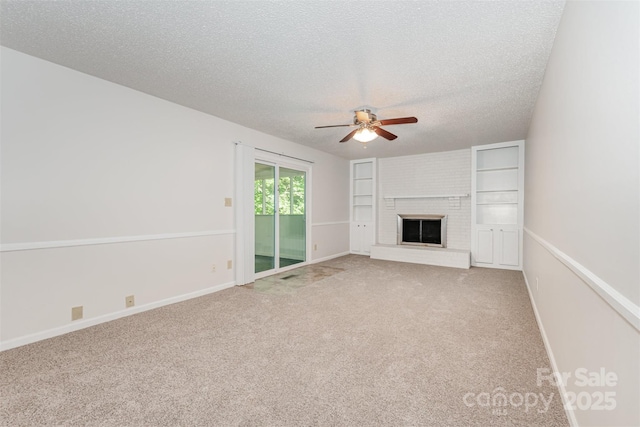 7008 Wannamaker Ln, Charlotte, NC 28226 - unfurnished living room with ceiling fan, a textured ceiling, carpet, and a fireplace