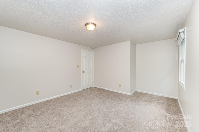 7008 Wannamaker Ln, Charlotte, NC 28226 - spare room with light carpet and a textured ceiling
