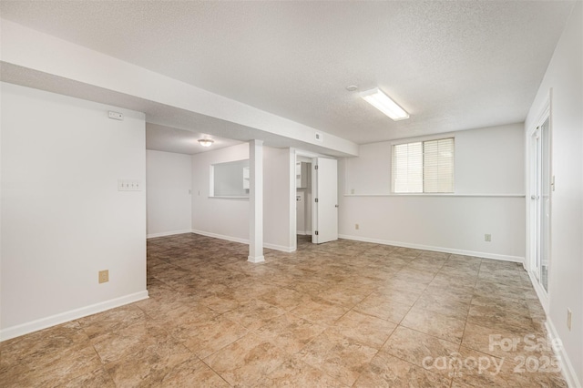 7008 Wannamaker Ln, Charlotte, NC 28226 - spare room with a textured ceiling and baseboards