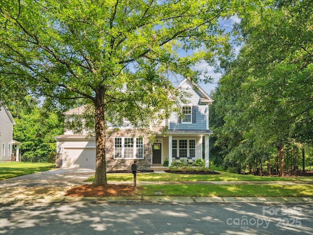 1008 Millbridge Pkwy, Waxhaw, NC 28173 - view of front of property with concrete driveway, a front lawn, stone siding, and an attached garage