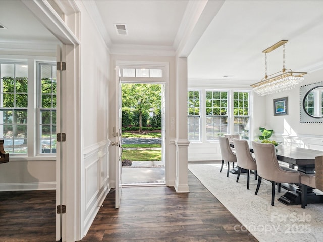 1008 Millbridge Pkwy, Waxhaw, NC 28173 - foyer entrance featuring dark wood-style floors, ornamental molding, a decorative wall, and a wainscoted wall