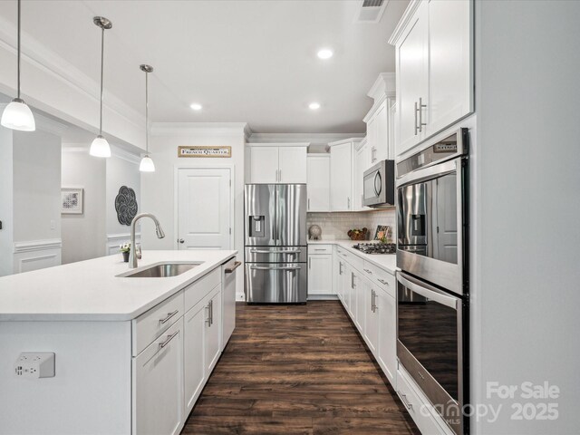 1008 Millbridge Pkwy, Waxhaw, NC 28173 - kitchen with stainless steel appliances, light countertops, white cabinetry, decorative backsplash, and recessed lighting