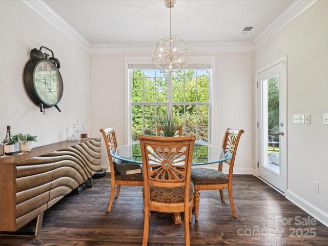 1008 Millbridge Pkwy, Waxhaw, NC 28173 - dining area featuring a chandelier, dark wood-style flooring, healthy amount of natural light, and crown molding