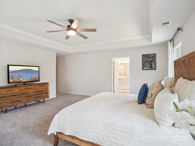 1008 Millbridge Pkwy, Waxhaw, NC 28173 - carpeted bedroom featuring a tray ceiling, crown molding, connected bathroom, and a ceiling fan