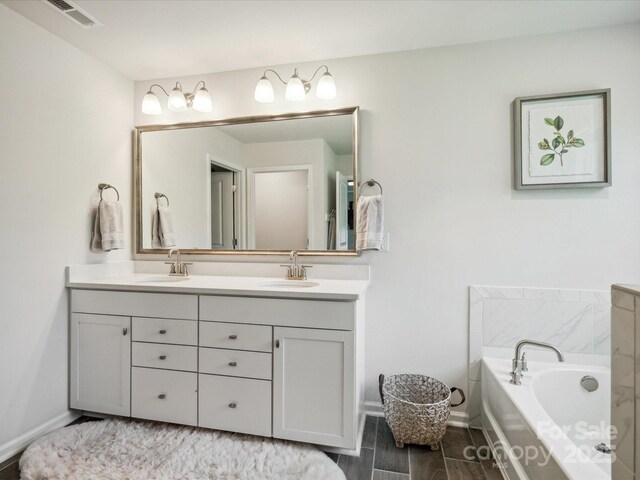 1008 Millbridge Pkwy, Waxhaw, NC 28173 - bathroom with double vanity and a bath