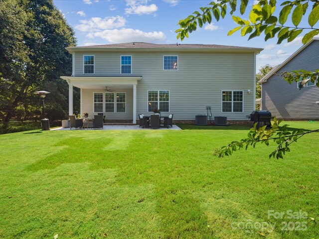 1008 Millbridge Pkwy, Waxhaw, NC 28173 - back of property with a ceiling fan, a patio area, and a lawn