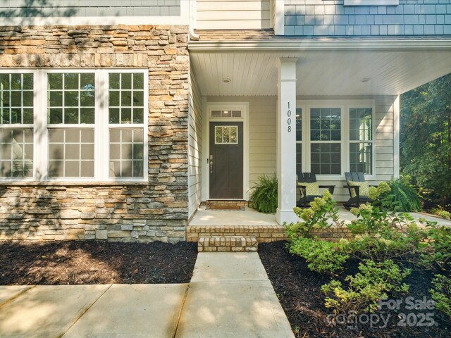 1008 Millbridge Pkwy, Waxhaw, NC 28173 - entrance to property with stone siding and a porch