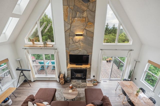 3381 Stones Throw Dr, Valdese, NC 28690 - living room with high vaulted ceiling, a skylight, and wood finished floors