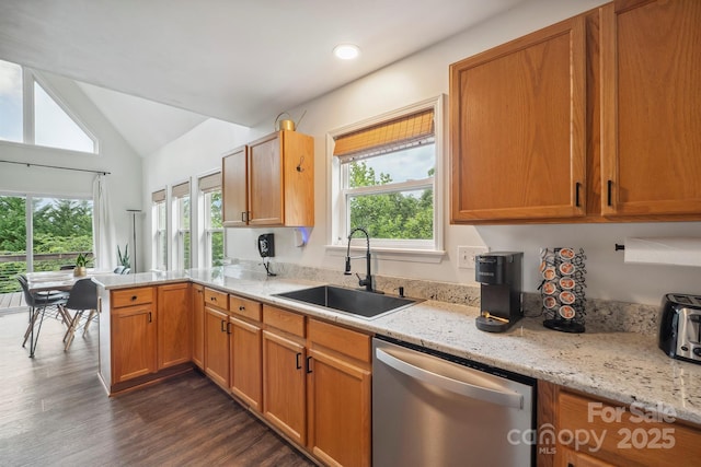 3381 Stones Throw Dr, Valdese, NC 28690 - kitchen with dishwasher, dark wood-style floors, a peninsula, healthy amount of natural light, and vaulted ceiling