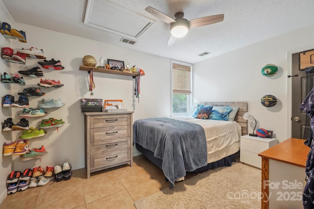 3381 Stones Throw Dr, Valdese, NC 28690 - bedroom with attic access, a textured ceiling, light tile patterned flooring, and a ceiling fan