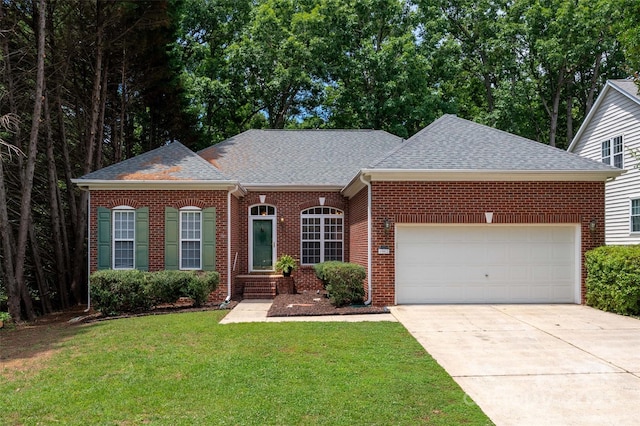 8002 Kingston Dr, Waxhaw, NC 28173 - view of front of property with a shingled roof, brick siding, concrete driveway, an attached garage, and a front yard