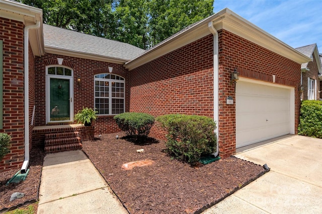 8002 Kingston Dr, Waxhaw, NC 28173 - view of front facade featuring brick siding, a garage, driveway, and a shingled roof
