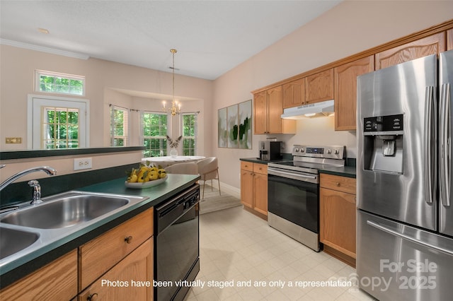 8002 Kingston Dr, Waxhaw, NC 28173 - kitchen featuring appliances with stainless steel finishes, under cabinet range hood, dark countertops, decorative light fixtures, and a chandelier