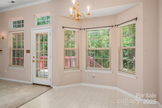8002 Kingston Dr, Waxhaw, NC 28173 - doorway to outside with a chandelier, ornamental molding, and healthy amount of natural light