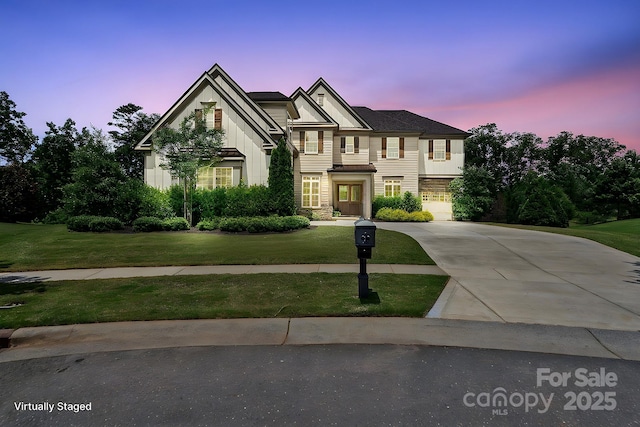 426 Kirkbride Ct, Fort Mill, SC 29715 - view of front of property featuring driveway, a front yard, board and batten siding, and stone siding