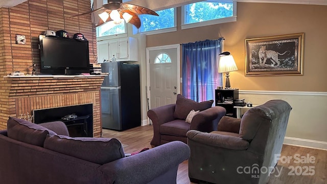 1010 Sprucewood St, Kannapolis, NC 28081 - living area featuring ceiling fan, light wood-type flooring, and a fireplace