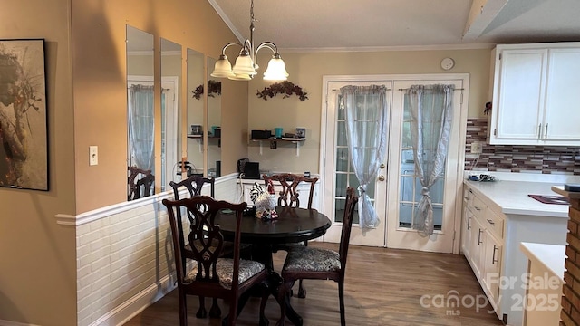 1010 Sprucewood St, Kannapolis, NC 28081 - dining room featuring dark wood-style floors, ornamental molding, a chandelier, and french doors