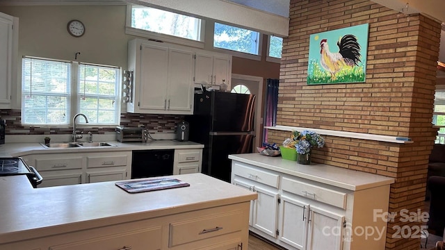 1010 Sprucewood St, Kannapolis, NC 28081 - kitchen with freestanding refrigerator, light countertops, healthy amount of natural light, and backsplash