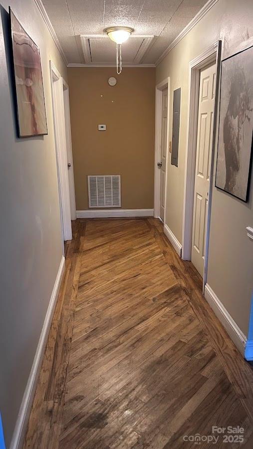 1010 Sprucewood St, Kannapolis, NC 28081 - corridor with crown molding, electric panel, wood finished floors, and attic access