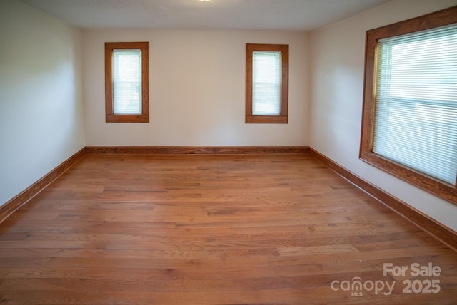4879 Denton Chapel Rd, Morganton, NC 28655 - spare room with light wood-type flooring and baseboards